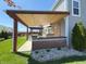 Covered outdoor kitchen with built-in grill, counter space, and wood ceiling at 5493 W Woodhaven Dr, McCordsville, IN 46055