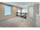 Upstairs landing featuring neutral carpeting, stairs to the lower level, and a large window at 5493 W Woodhaven Dr, McCordsville, IN 46055