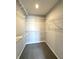Walk-in closet featuring carpet floors, built-in wire shelving, and ample storage space at 5493 W Woodhaven Dr, McCordsville, IN 46055
