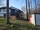 View of backyard of home with shed and exposed foundation at 5739 E 62Nd Pl, Indianapolis, IN 46220