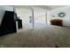 Finished basement with carpet flooring, black stairs, and ample space for recreation at 5739 E 62Nd Pl, Indianapolis, IN 46220
