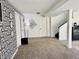 Finished basement area showcasing a geometric wall, doors, and carpeting at 5739 E 62Nd Pl, Indianapolis, IN 46220