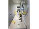 Bright bathroom with double sinks, quartz countertops, and modern fixtures at 5739 E 62Nd Pl, Indianapolis, IN 46220