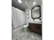 Contemporary bathroom featuring a vanity with storage, modern fixtures, and a shower with curtain at 5739 E 62Nd Pl, Indianapolis, IN 46220