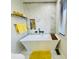 Modern bathroom featuring a freestanding tub, marble walls, and bright natural light at 5739 E 62Nd Pl, Indianapolis, IN 46220