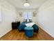 Cozy bedroom with hardwood floors, natural light, and stylish blue accents at 5739 E 62Nd Pl, Indianapolis, IN 46220