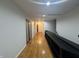 Second floor hallway with hardwood floors and modern design at 5739 E 62Nd Pl, Indianapolis, IN 46220