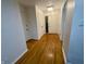 Spacious hallway with hardwood floors, leading to various rooms and closet space at 5739 E 62Nd Pl, Indianapolis, IN 46220