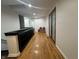 Upstairs hallway with beautiful hardwood floors and natural lighting at 5739 E 62Nd Pl, Indianapolis, IN 46220