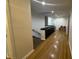 Bright hallway featuring hardwood floors and a convenient built-in storage unit at 5739 E 62Nd Pl, Indianapolis, IN 46220