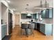Modern kitchen with quartz countertops, stainless steel appliances, and an eat-in island at 5739 E 62Nd Pl, Indianapolis, IN 46220