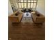 Stylish living room featuring hardwood floors and modern seating arrangement at 5739 E 62Nd Pl, Indianapolis, IN 46220