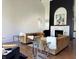 Bright living room highlighting a fireplace, designer seating, and contemporary decor at 5739 E 62Nd Pl, Indianapolis, IN 46220