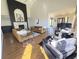 Open-concept living room with a fireplace and modern furnishings, offering a stylish living space at 5739 E 62Nd Pl, Indianapolis, IN 46220
