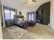 Beautiful main bedroom with a fireplace, large windows, and a luxurious king-sized bed at 5739 E 62Nd Pl, Indianapolis, IN 46220