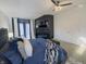 Stunning main bedroom with fireplace, a king bed, and large windows for natural light at 5739 E 62Nd Pl, Indianapolis, IN 46220
