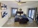 Spacious main bedroom with a king bed, stylish decor, plush carpet, and great natural light at 5739 E 62Nd Pl, Indianapolis, IN 46220