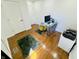 Bright office space featuring hardwood floors, a workstation and a printer at 5739 E 62Nd Pl, Indianapolis, IN 46220