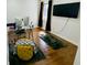 Bright office space featuring hardwood floors, a workstation and large wall-mounted television at 5739 E 62Nd Pl, Indianapolis, IN 46220