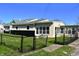 A fenced backyard featuring a sunroom and black accents on the exterior at 601 Duane St, Franklin, IN 46131