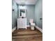 Well-lit bathroom featuring a modern vanity, mirror, and fixtures at 601 Duane St, Franklin, IN 46131
