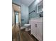 Bathroom with modern vanity, updated fixtures and wood-look flooring at 601 Duane St, Franklin, IN 46131