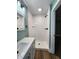 Bathroom shower featuring white subway tile, black fixtures, and a white shower base at 601 Duane St, Franklin, IN 46131