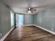 Bedroom with laminate floors, blue paint, white trim and door, and a ceiling fan at 601 Duane St, Franklin, IN 46131