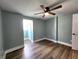Cozy bedroom featuring new flooring and a ceiling fan at 601 Duane St, Franklin, IN 46131