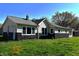 Charming single-story home with black and cream exterior and well-maintained lawn at 601 Duane St, Franklin, IN 46131
