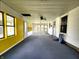Spacious sun room with bright yellow accents and plenty of natural light at 601 Duane St, Franklin, IN 46131