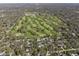 Aerial view of a golf course surrounded by residential homes and lush greenery at 6025 Crows Nest Dr, Indianapolis, IN 46228