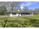 Exterior of the home with a spacious lawn, perfect for outdoor activities and relaxation at 6025 Crows Nest Dr, Indianapolis, IN 46228