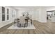 Elegant dining room featuring stylish decor, hardwood floors, and a modern light fixture at 6025 Crows Nest Dr, Indianapolis, IN 46228