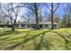 Charming ranch-style home featuring a beautiful lawn and mature trees in a desirable neighborhood at 6025 Crows Nest Dr, Indianapolis, IN 46228