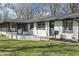 Cozy ranch home with a well-manicured lawn and a charming front entrance at 6025 Crows Nest Dr, Indianapolis, IN 46228