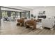 Bright living room featuring modern furniture, fireplace, and light-filled windows offering a view at 6025 Crows Nest Dr, Indianapolis, IN 46228