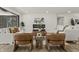 Contemporary living room with a cozy seating area, fireplace, modern art, and wood-look flooring at 6025 Crows Nest Dr, Indianapolis, IN 46228