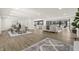 Open concept living space featuring hardwood floors, modern decor, and abundant natural light at 6025 Crows Nest Dr, Indianapolis, IN 46228