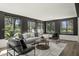 Modern sun room with great natural light from plentiful windows and comfortable, contemporary furnishings at 6025 Crows Nest Dr, Indianapolis, IN 46228