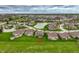 Expansive aerial view showcasing the property's location within a sprawling residential community near a pond and green spaces at 6049 Royal Gate Pl, Indianapolis, IN 46237