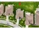 Aerial view highlighting the home's backyard patio, professional landscaping, and overall property layout in a residential area at 6049 Royal Gate Pl, Indianapolis, IN 46237