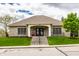 Community clubhouse featuring a welcoming entrance with stairs, a covered entryway, and professional landscaping at 6049 Royal Gate Pl, Indianapolis, IN 46237