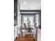 Eat-in kitchen dining area with bay windows and access to outdoor patio at 6049 Royal Gate Pl, Indianapolis, IN 46237