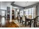 Spacious dining area with hardwood floors, view into the foyer, and a modern chandelier at 6049 Royal Gate Pl, Indianapolis, IN 46237