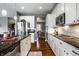 Kitchen featuring stainless appliances, granite countertops, and white cabinets at 6049 Royal Gate Pl, Indianapolis, IN 46237