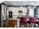 Kitchen featuring granite countertops, stainless appliances and an island with seating at 6049 Royal Gate Pl, Indianapolis, IN 46237