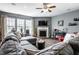 Cozy living room features a fireplace, large windows, and comfortable seating at 6049 Royal Gate Pl, Indianapolis, IN 46237