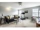 Spacious room features neutral walls, a comfortable sofa, and natural light from bright windows at 6049 Royal Gate Pl, Indianapolis, IN 46237