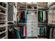 Organized walk-in closet with custom shelving and ample storage space for clothes and accessories at 6049 Royal Gate Pl, Indianapolis, IN 46237